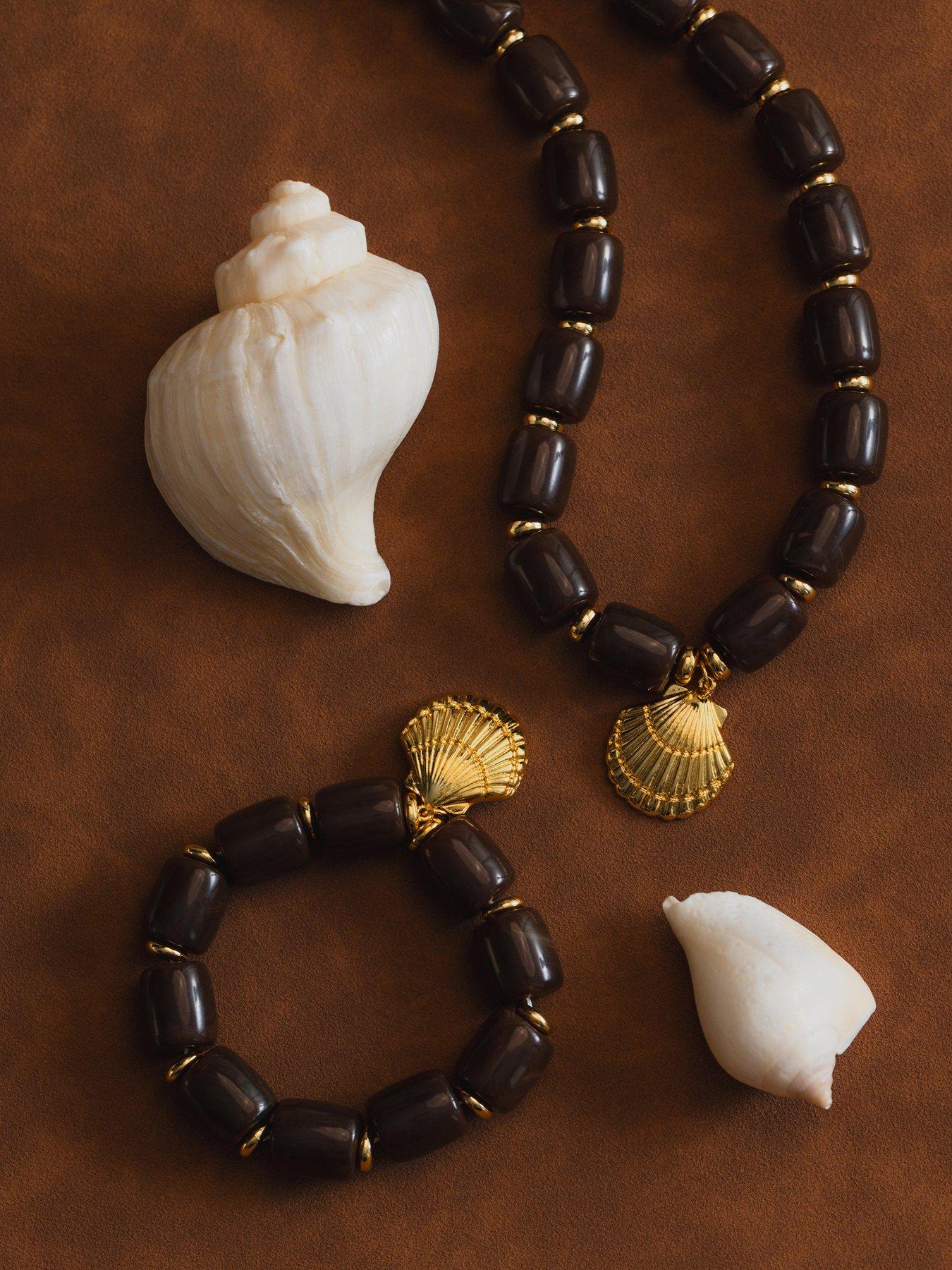 Image 4 of 7 of Orelia Statement Brown Bead Shell Drop Necklace