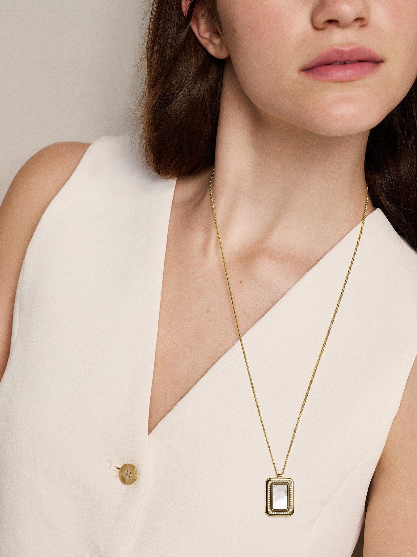 Image 1 of 7 of Fossil Raquel Mother-of-Pearl Spinning Pendant Necklace