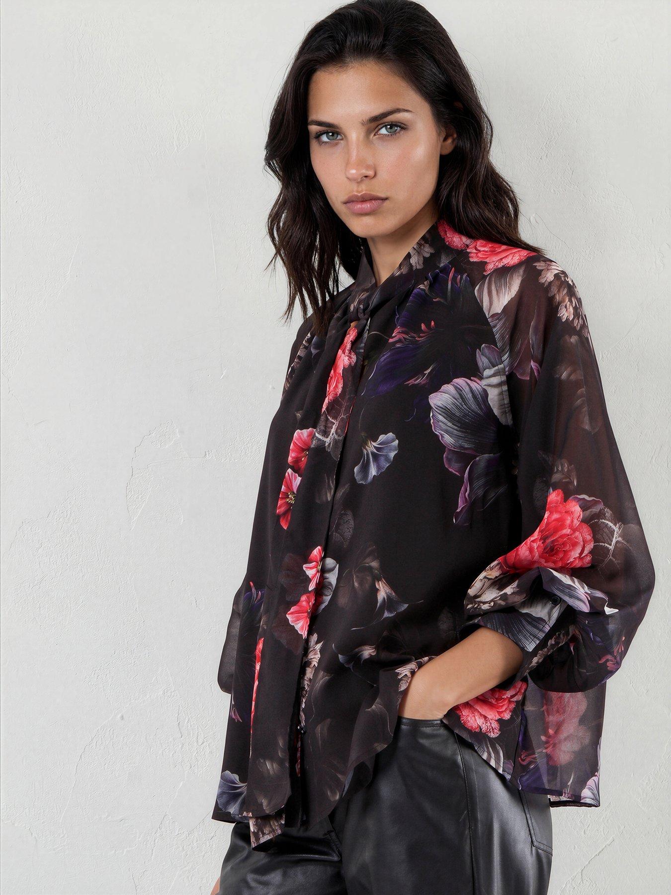 Image 1 of 7 of Religion Liv High Neck Button-Through&nbsp;Blouse With Tie Sash In Floral Red And Blue Print - Black