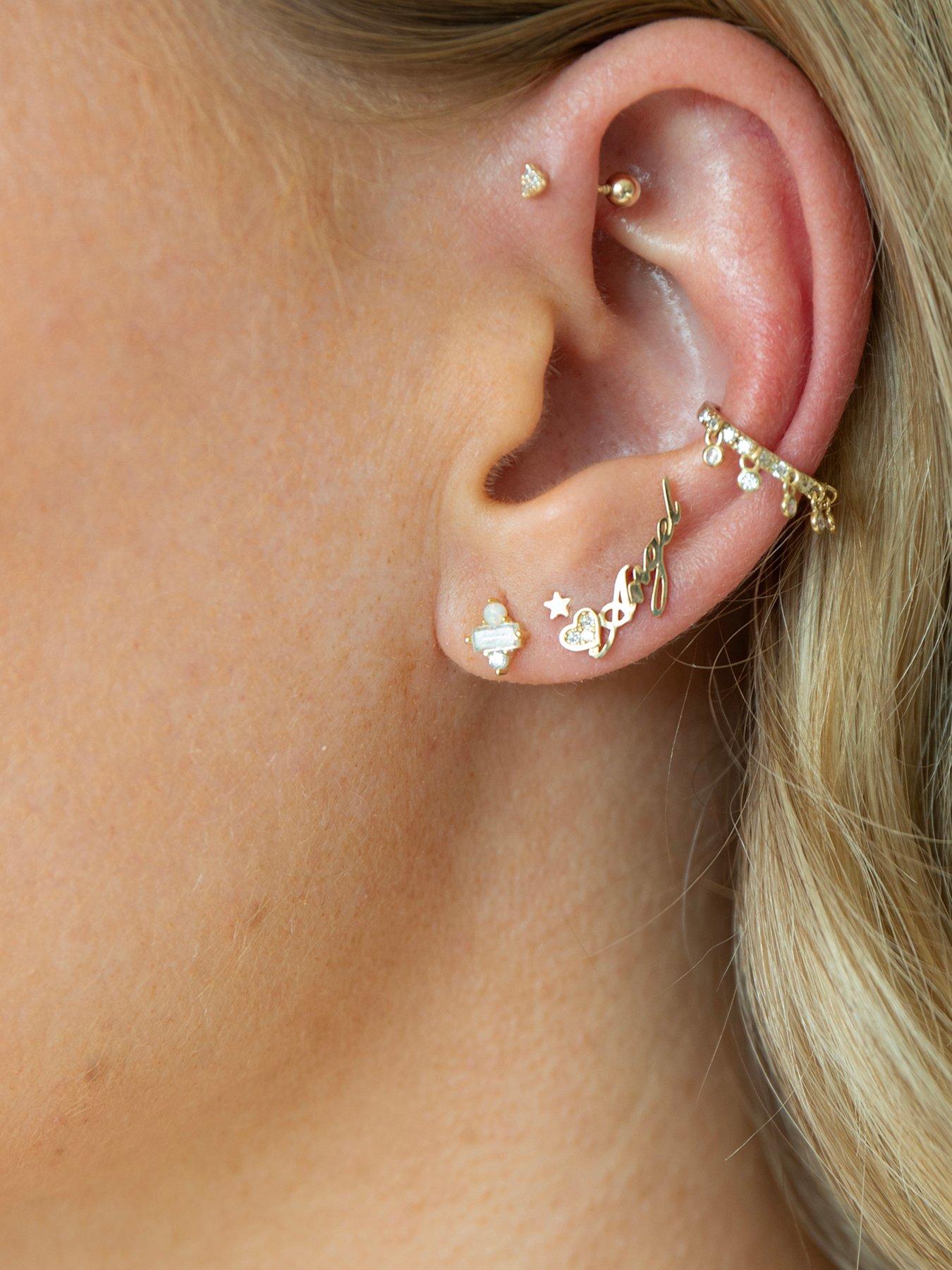 Image 6 of 7 of Seol + Gold 9ct Solid Gold Tiny Star Studs