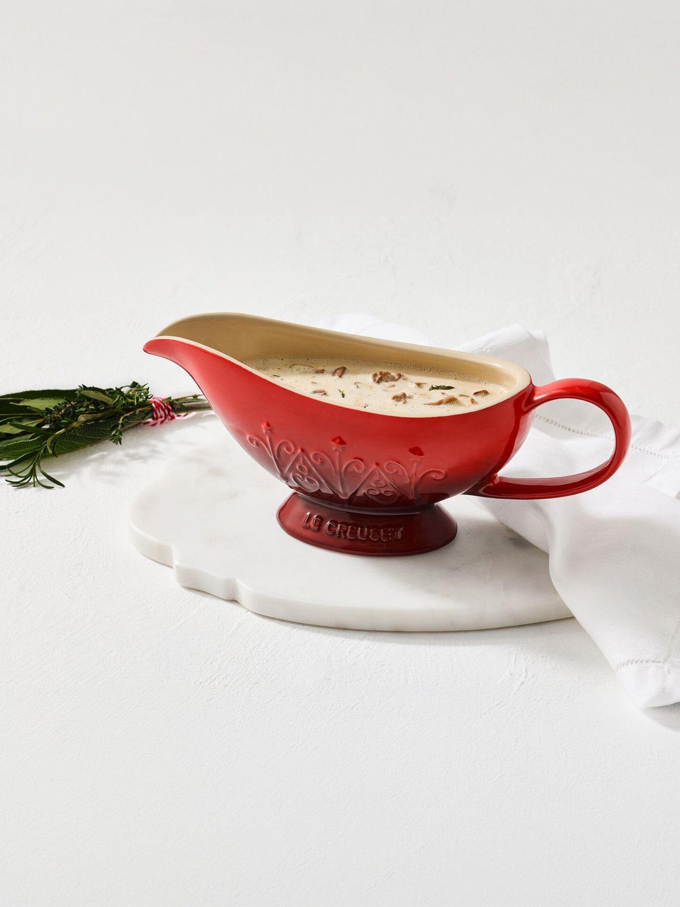 Image 1 of 6 of Le Creuset Stoneware Heritage Sauce Jug Christmas Relief Cerise