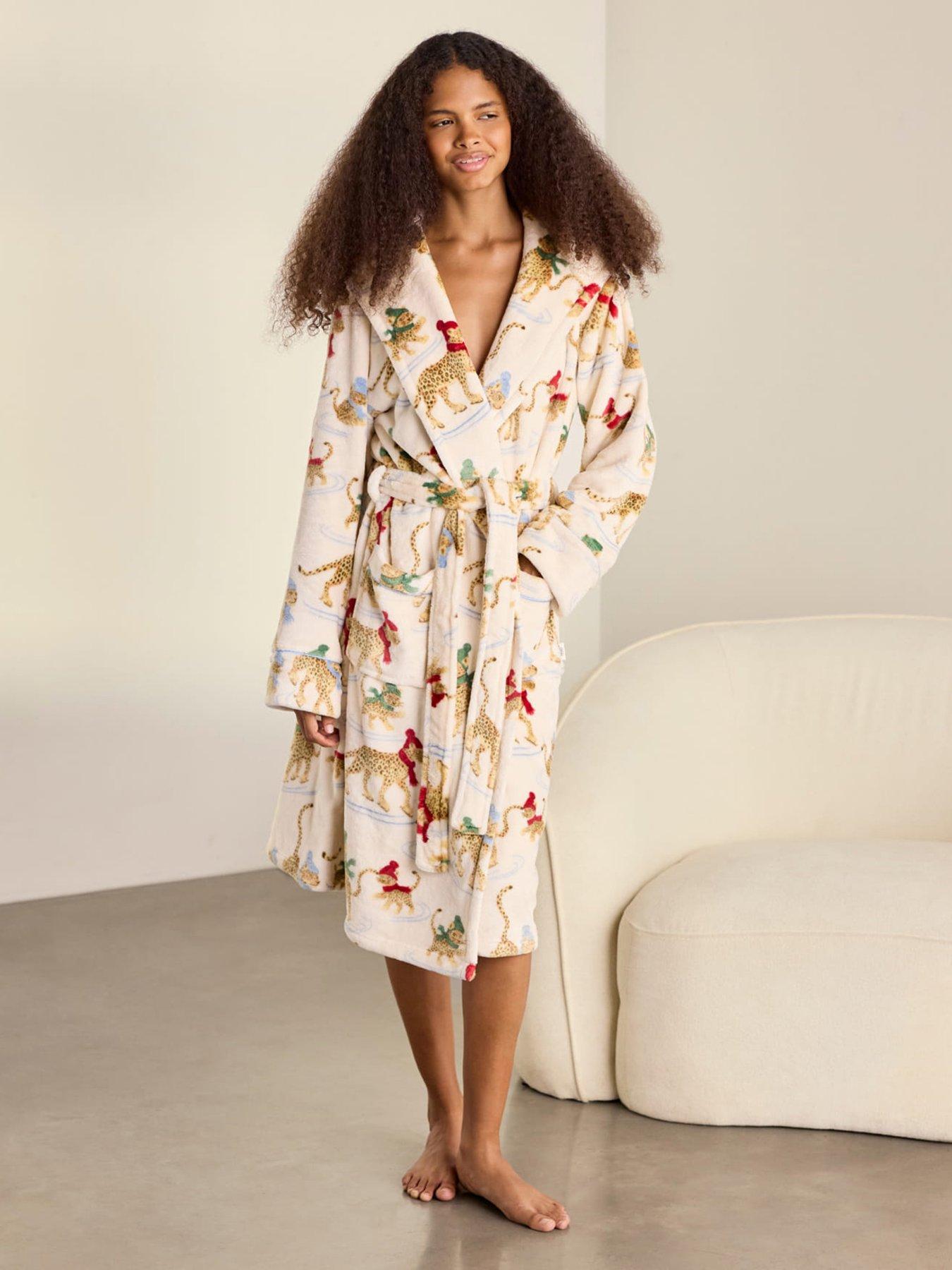 Image 1 of 6 of CHELSEA PEERS Fleece Ice Skating Leopards Print Hooded Dressing Gown - Off White