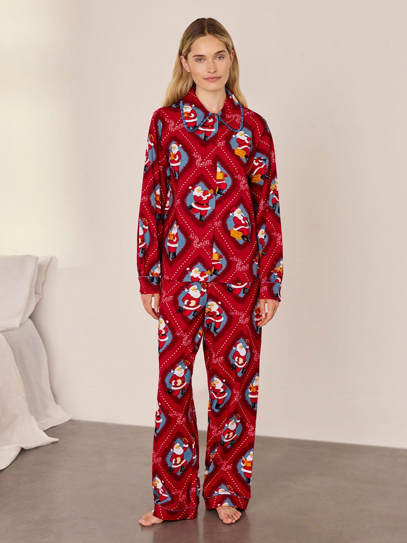 Image 1 of 6 of CHELSEA PEERS Organic Cotton Musical Santa's Songbook Print Long Pyjama Set - Red