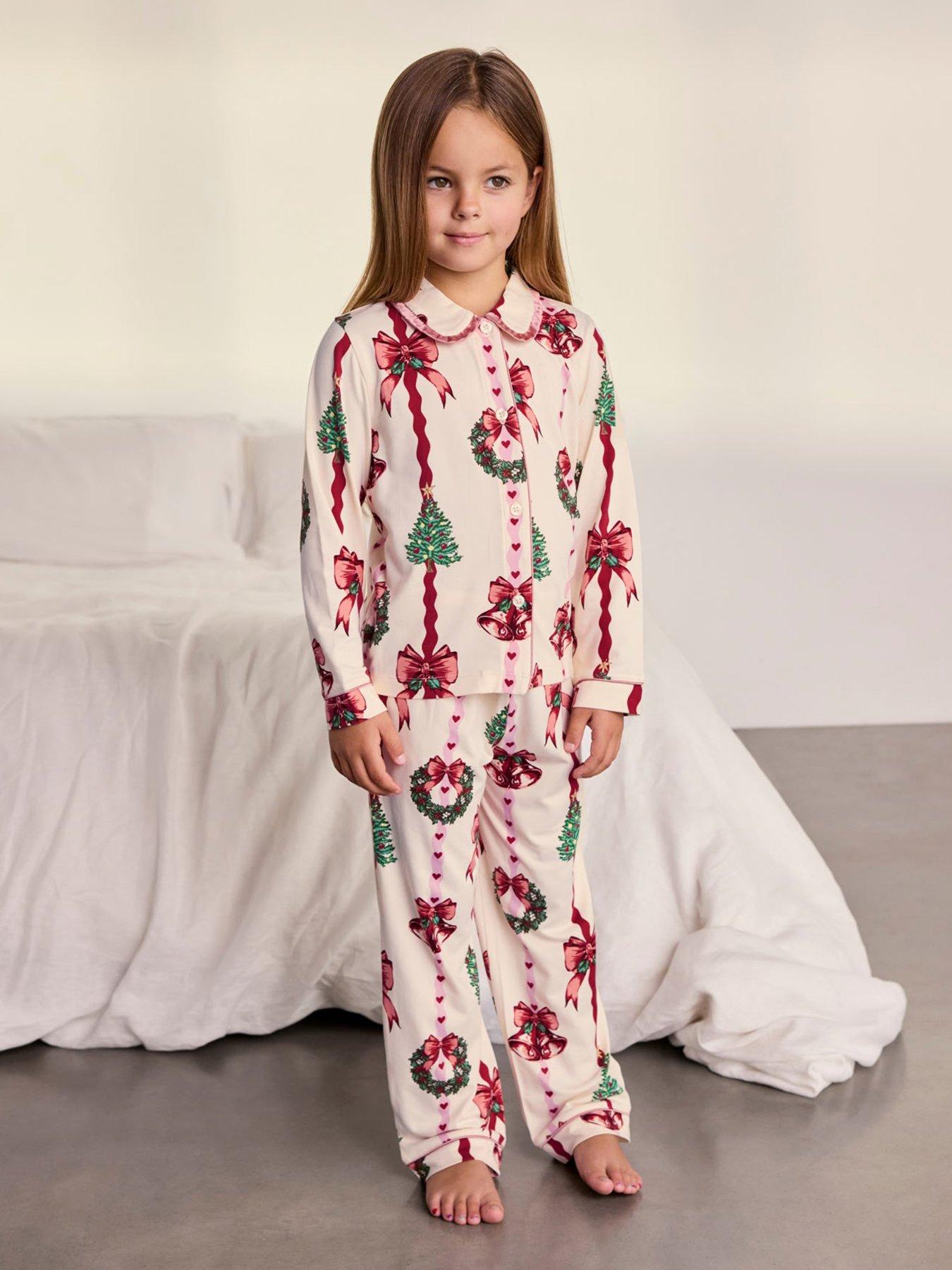 Image 1 of 7 of CHELSEA PEERS Kids Christmas Ribbon Stripe Print Long Pyjama Set - Off White